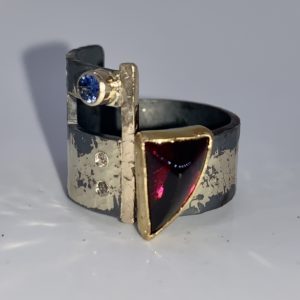 Garnet, diamonds and sapphire ring